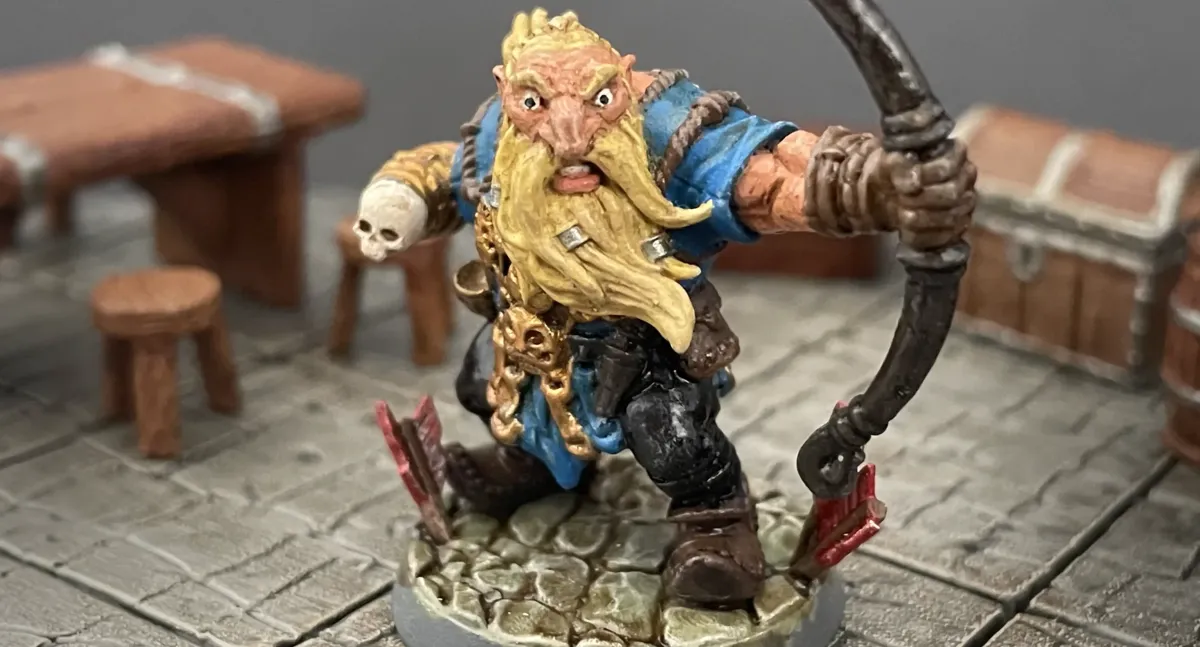 Finished Mountain Dwarf Ranger miniature with a longbow in a dungeon room