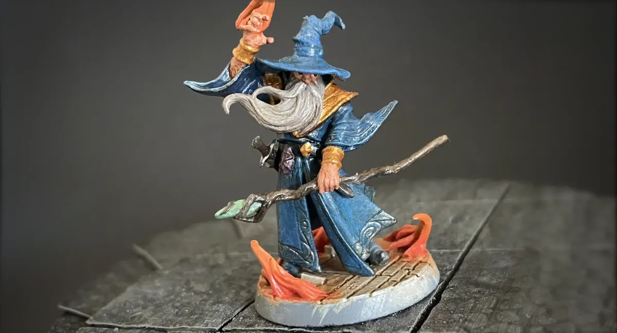 Finished Cornelius Greathat wizard miniature against a gray background